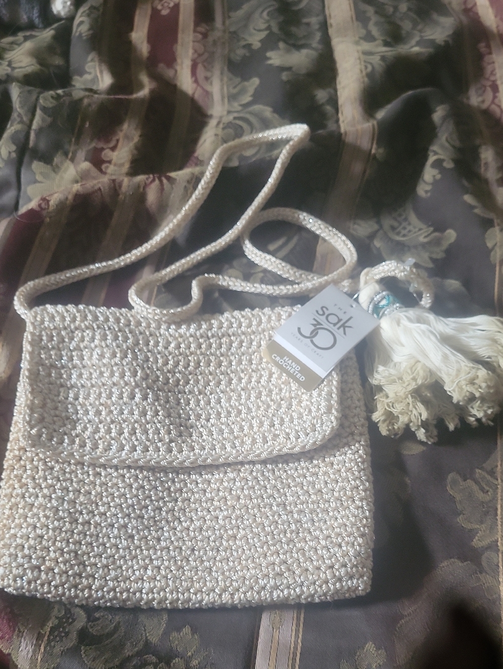 The Sak Costa Mesa Crossberry Tagged Dust Cover Tassel Fits Alot